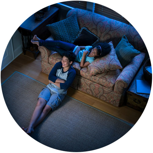 family watching tv on couch