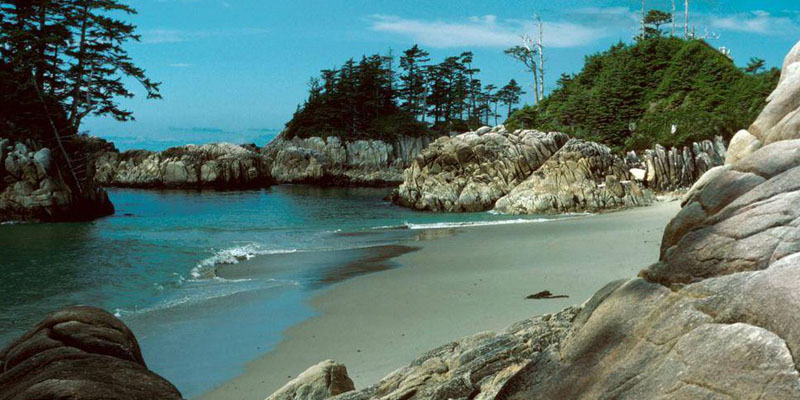 Blue sky and clear water at Calvert Island beach.