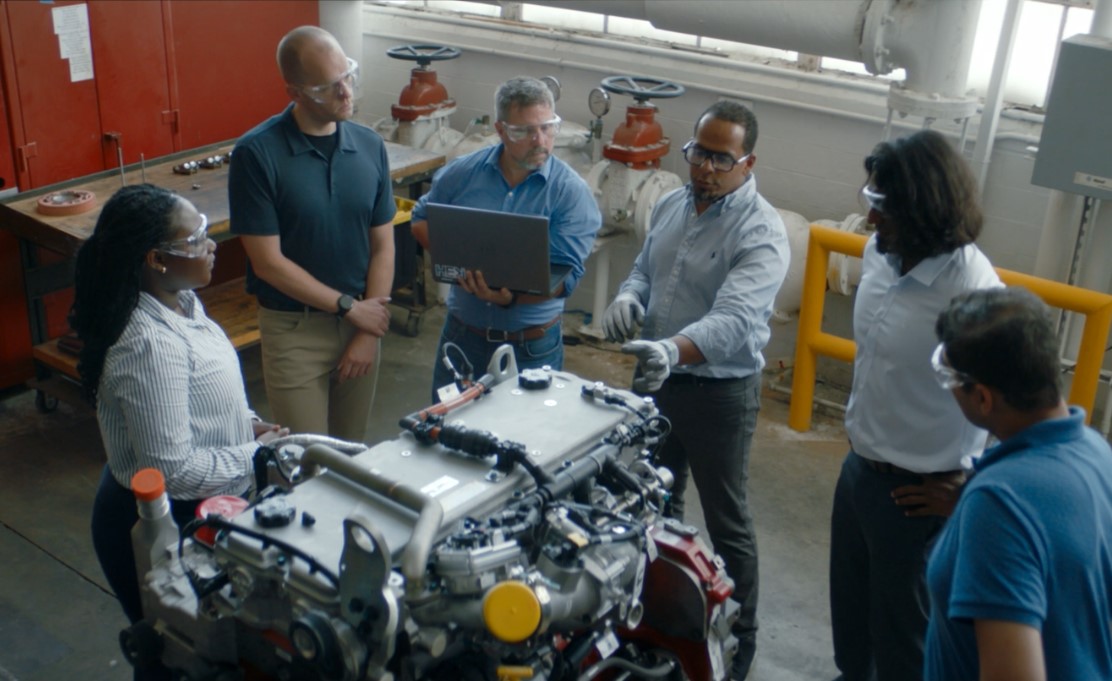 Team looking at X10 engine