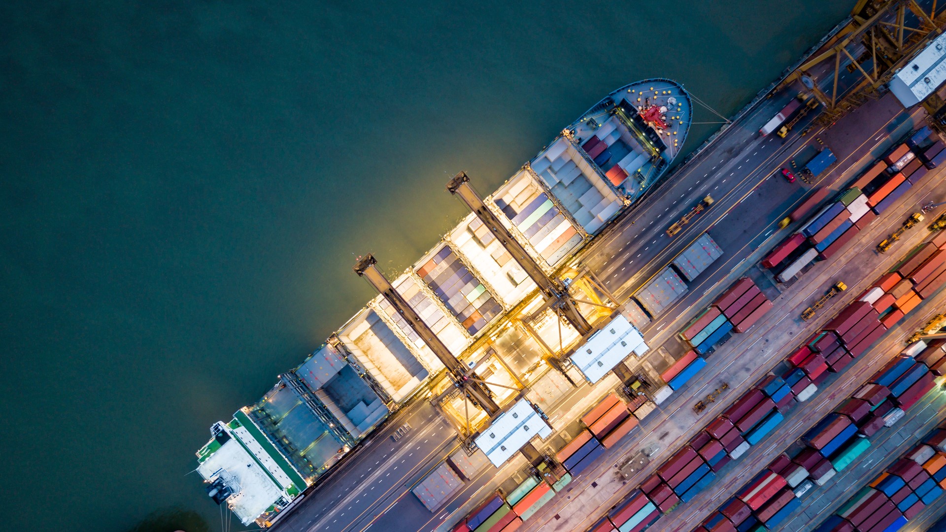Cargo ship at a dock during the night time