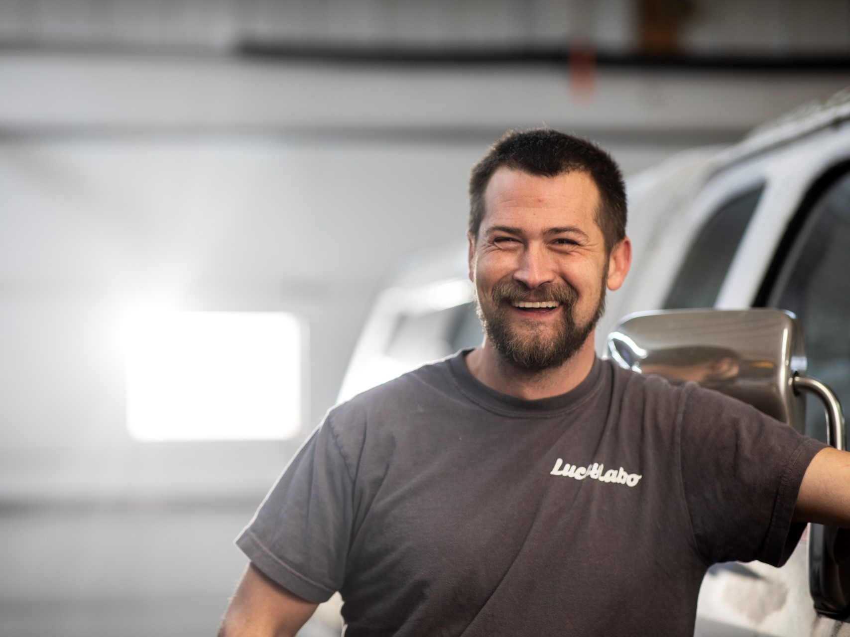 man next to old dodge ram truck