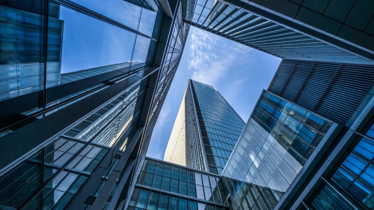 tall commercial buildings with blue glass