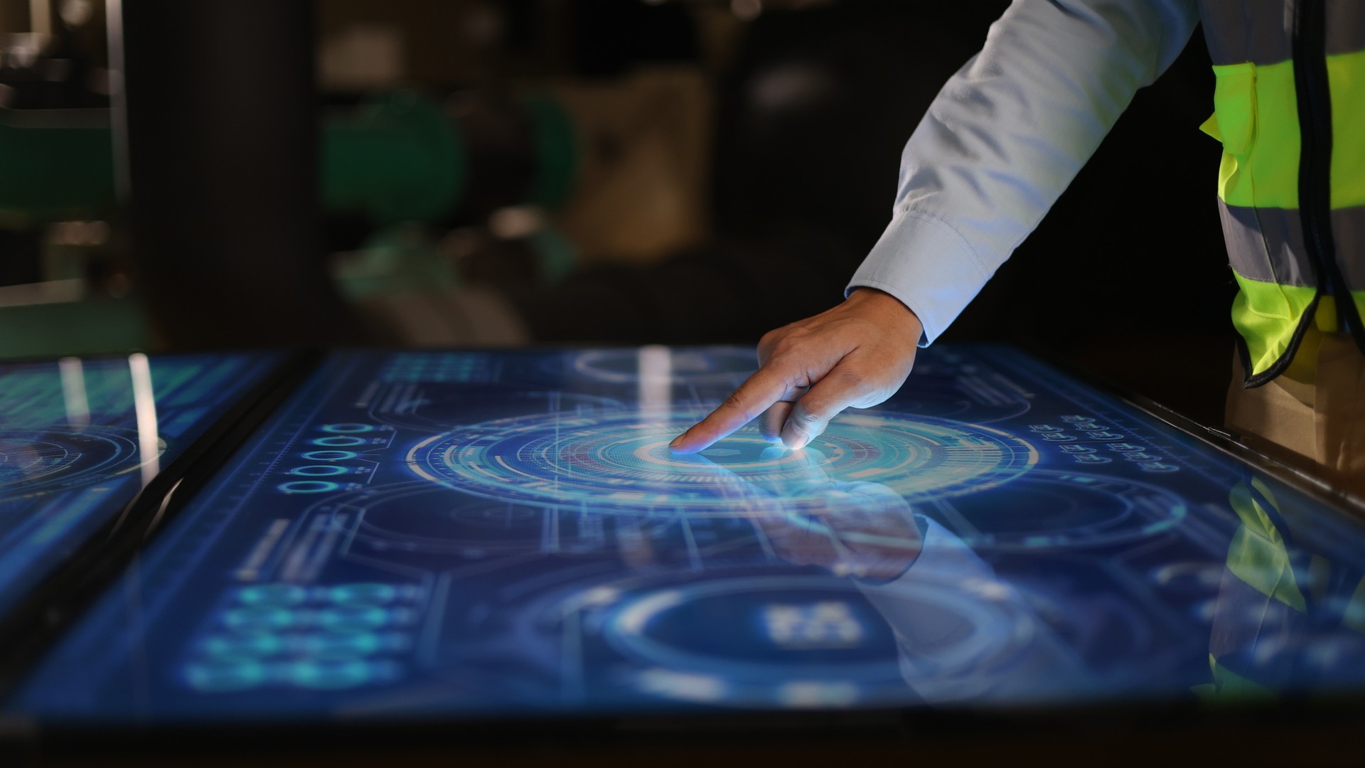 Construction worker using large touch pad device