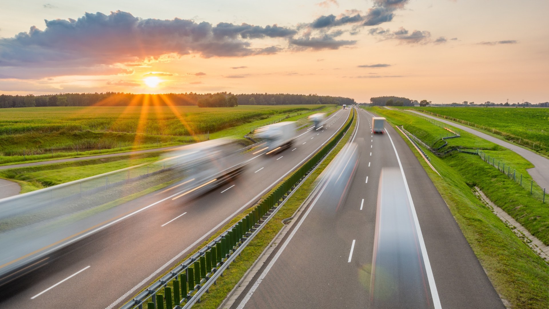 semi trucks driving on highway