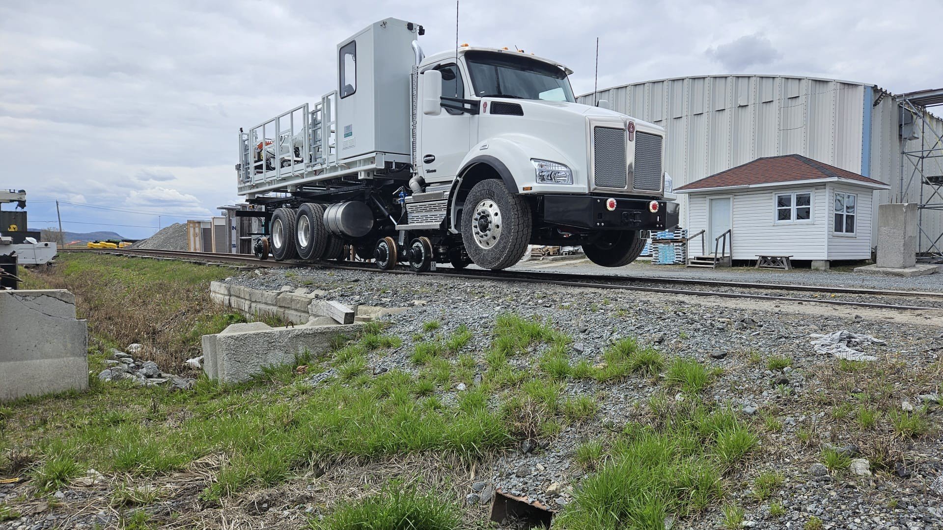 side view of truck with road rail conversion capabilities