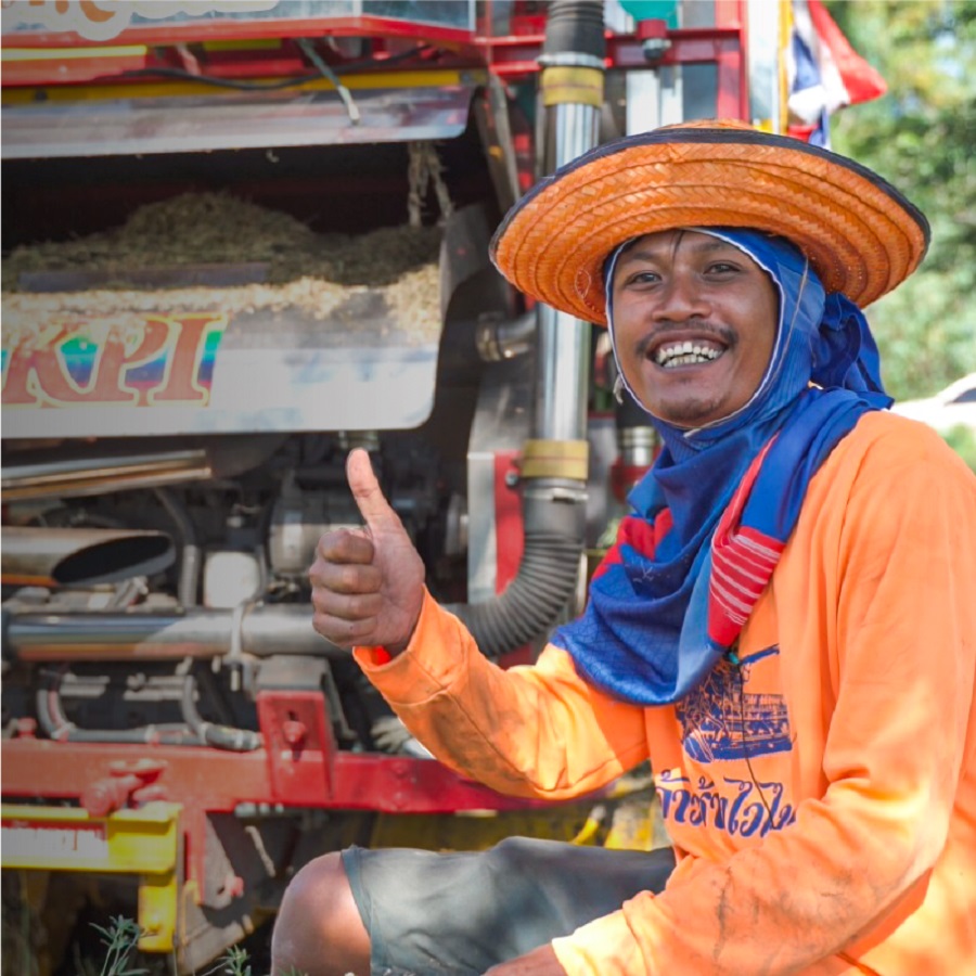 Person smiling while in the paddy fields