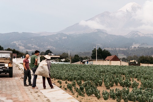 Stuart and Ploog talk to a local resident on their trip with&nbsp;Pico de Orizaba in the background.