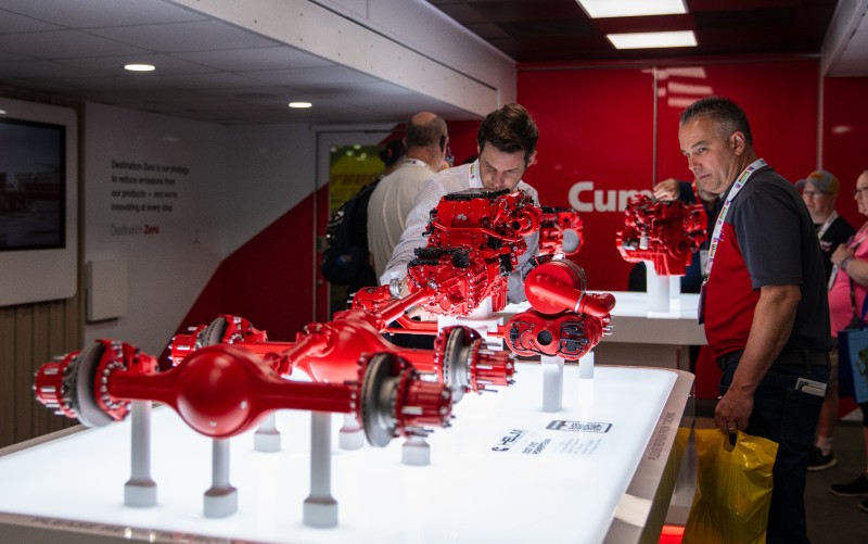People looking at Cummins showcase at the Mid-America Trucking Show