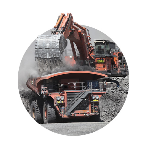 Mining digger dumping rocks 