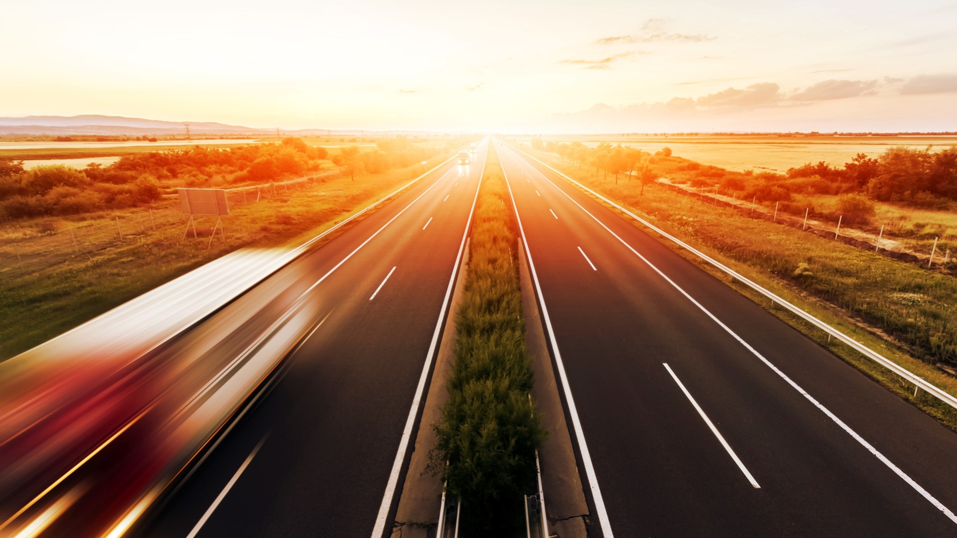 Highway with sunset on the horizon