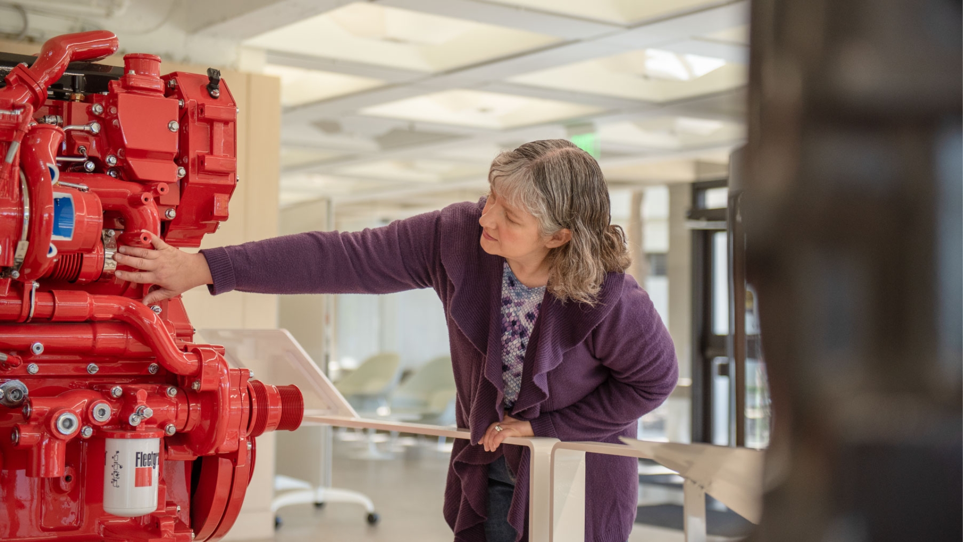 Jennifer, a Cummins engineer, inspects an X15 engine
