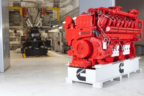 red QSK95 cummins engine displayed in an industrial setting