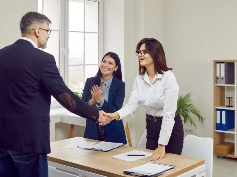 successful customer interaction and shaking hands