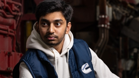 man with cummins vest merchandise