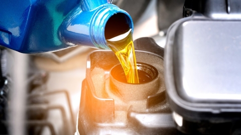 pouring oil into engine