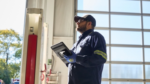 service technician checking engine