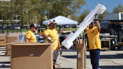 People taking boxes apart