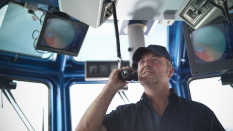 Captain of boat on radio