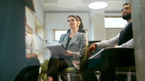 person listening to seminar in classroom