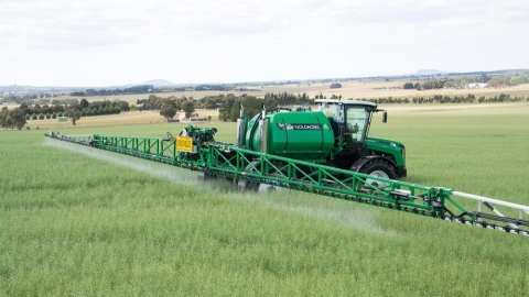 sprayer tractor on farm field
