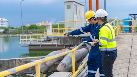 engineers inspecting water pump