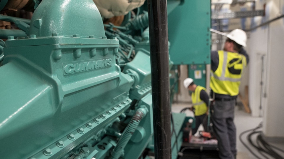service technicians working on large generator