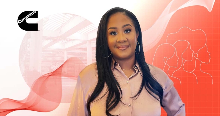 Woman posing next to cummins logo