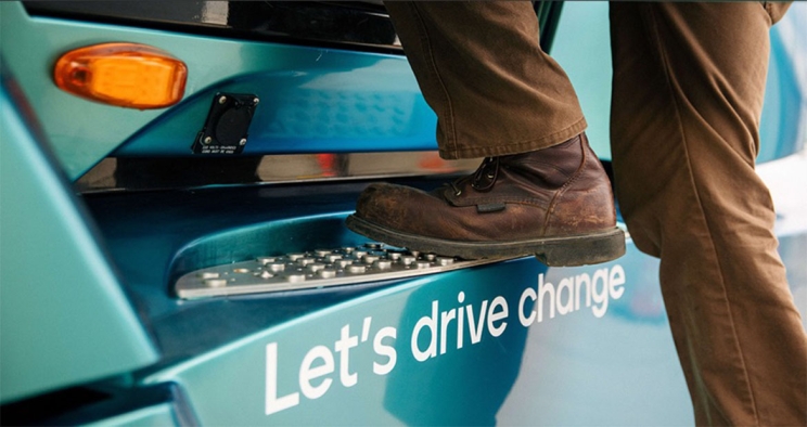 Person's boot stepping onto truck