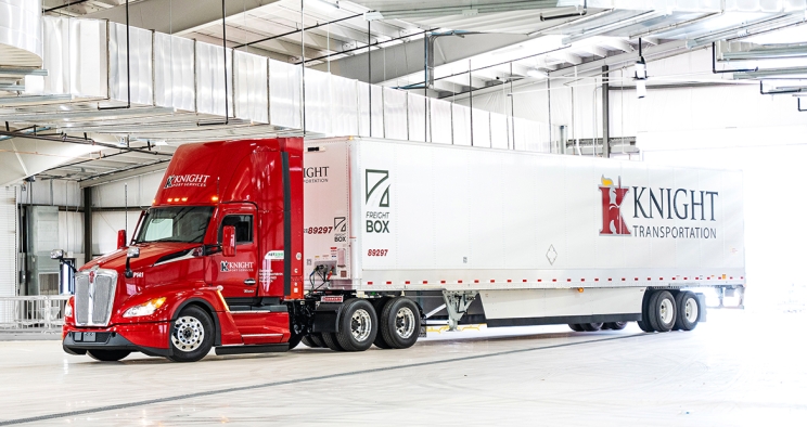 Knight-Swift semi truck parked in a garage