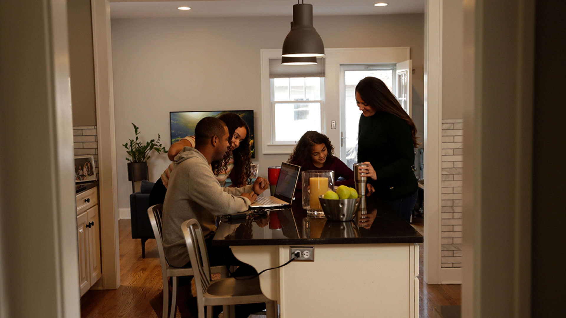 Family around a table in their home
