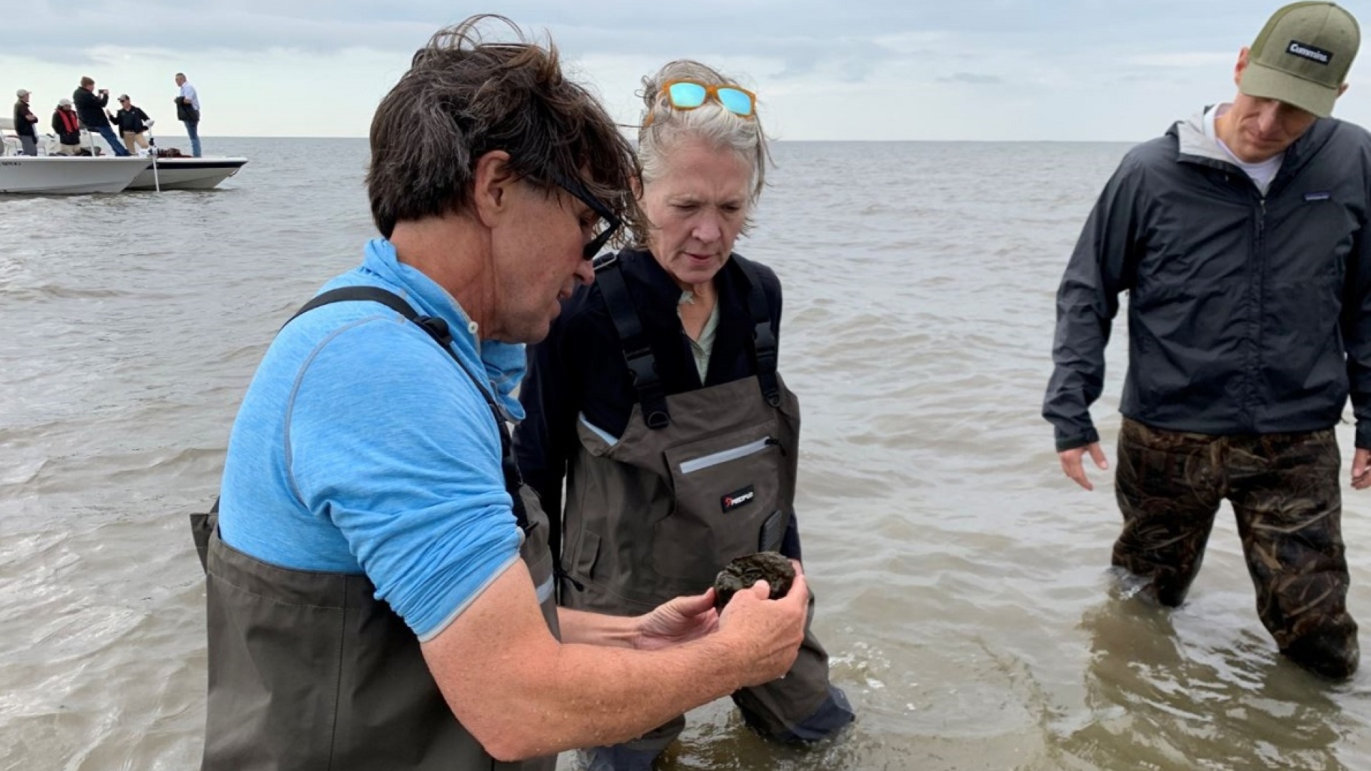 The Nature Conservancy’s Seth Blitch discusses the oyster reef project with Mary Chandler, Vice President – Community Relations and Corporate Responsibility, and Zach Gillen, General Manager -- Sales & Service North America.