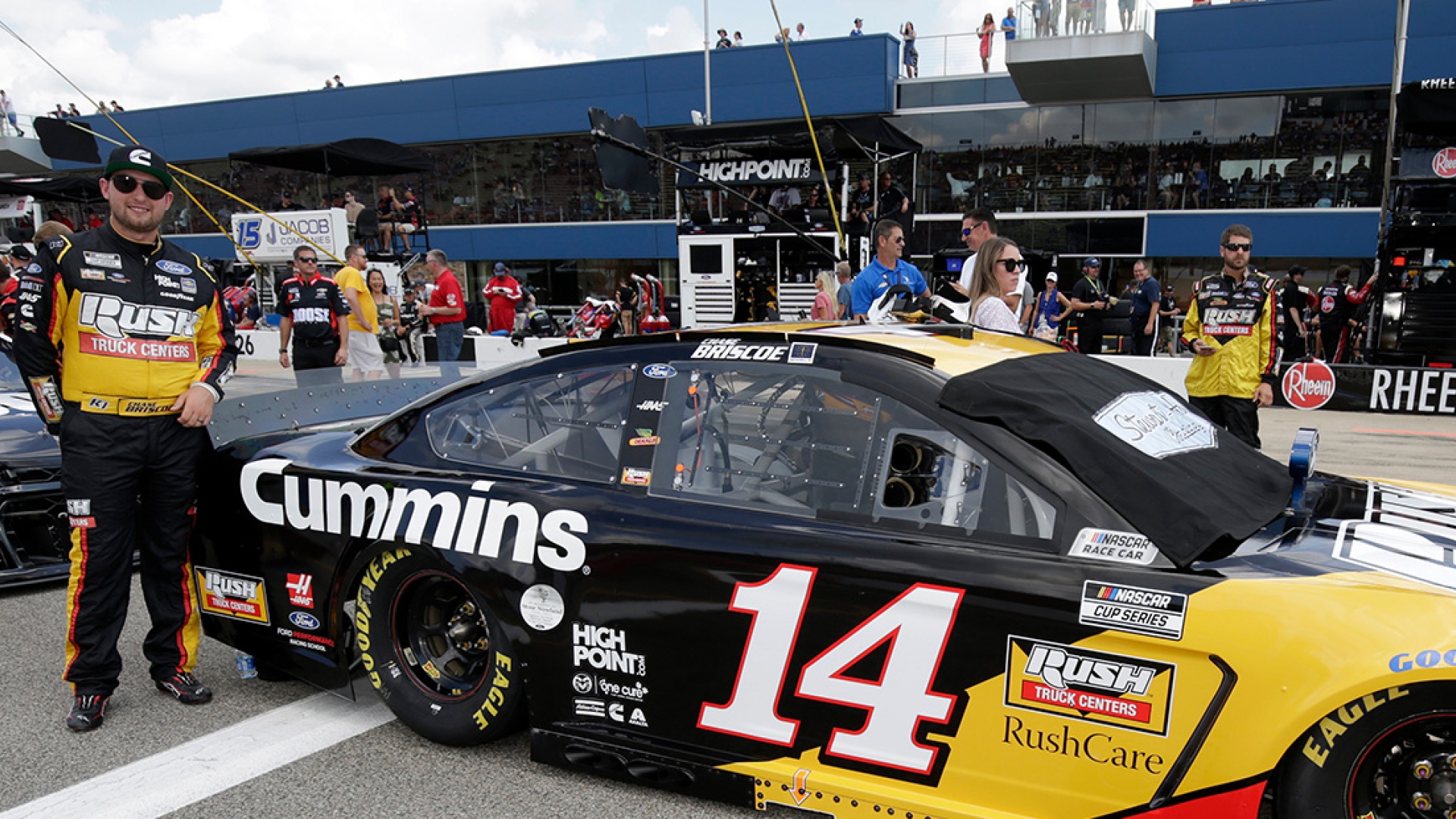 Chase Briscoe posing next to #14 car