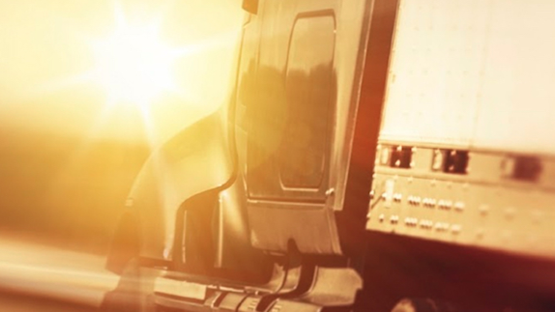 Truck driving towards the sun