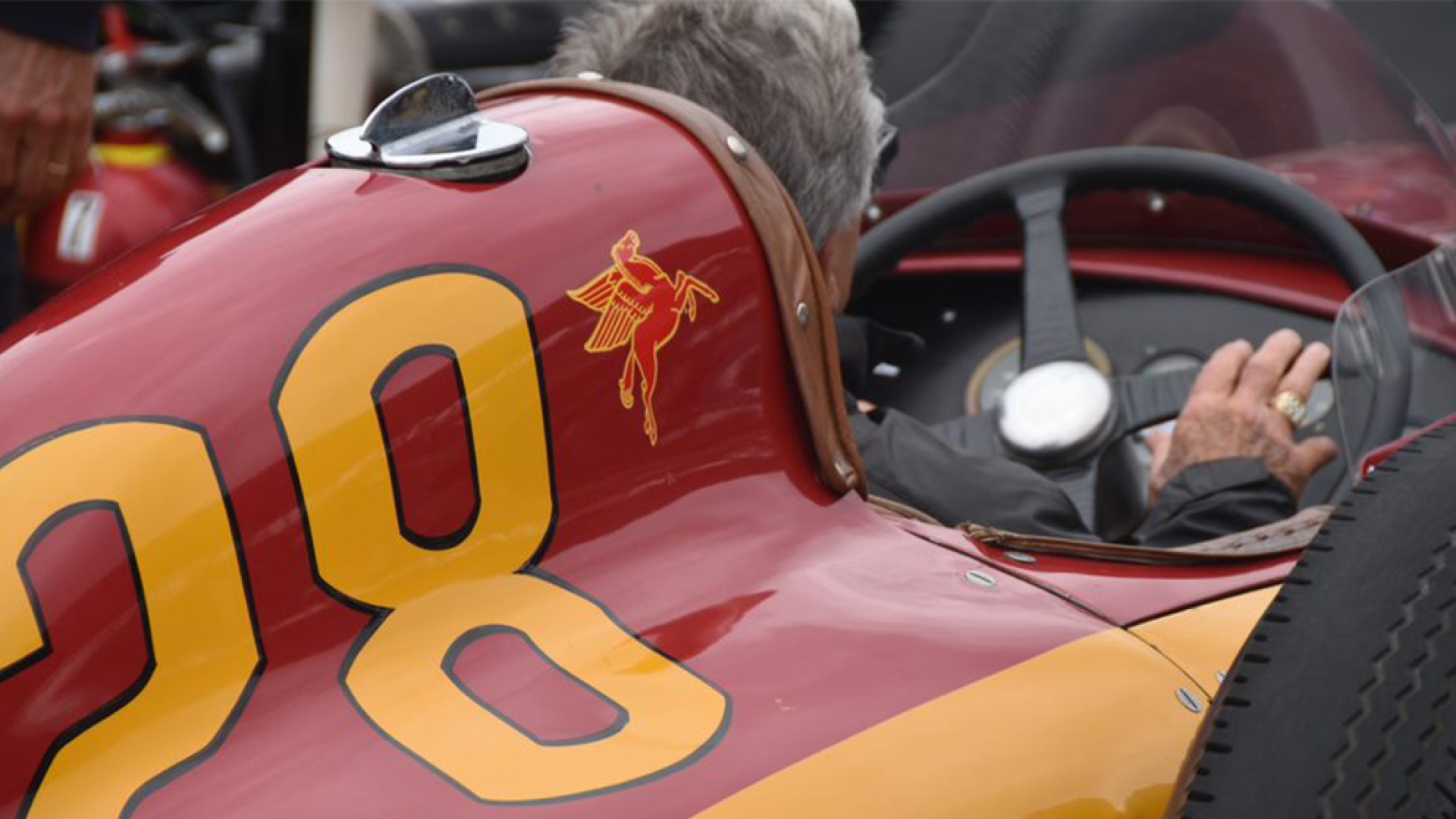 Mario Andretti driving the historic Cummins race car