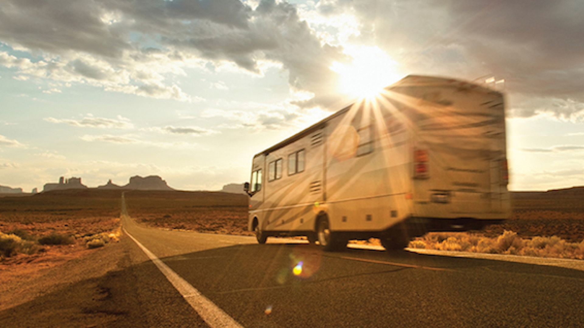rv driving on open desert road