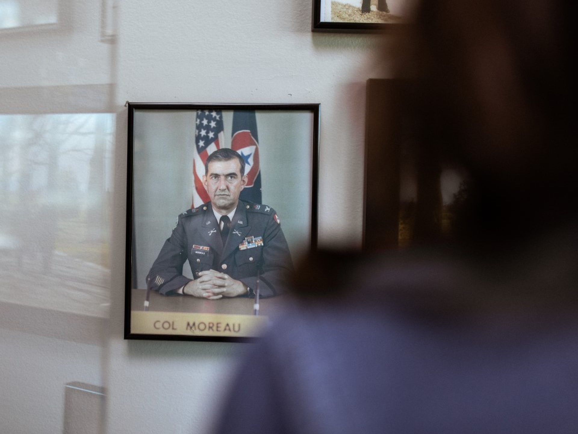 Woman looking at a photo of Col Moreua