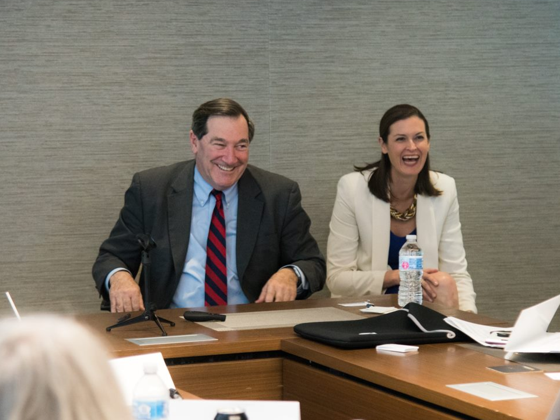 Katie sits next to Former Senator Joe Donnelly at a Hoosier Women Forward event.
