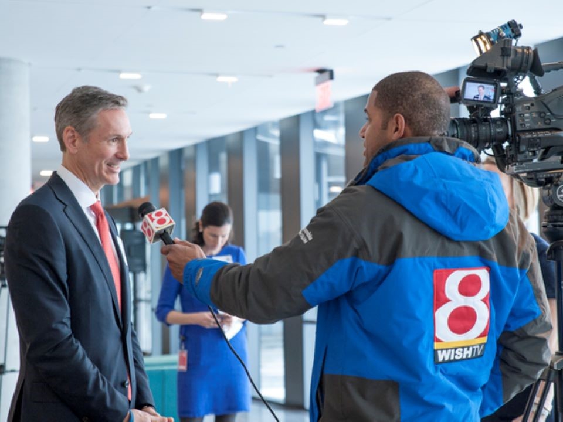Man being interviewed by a news team