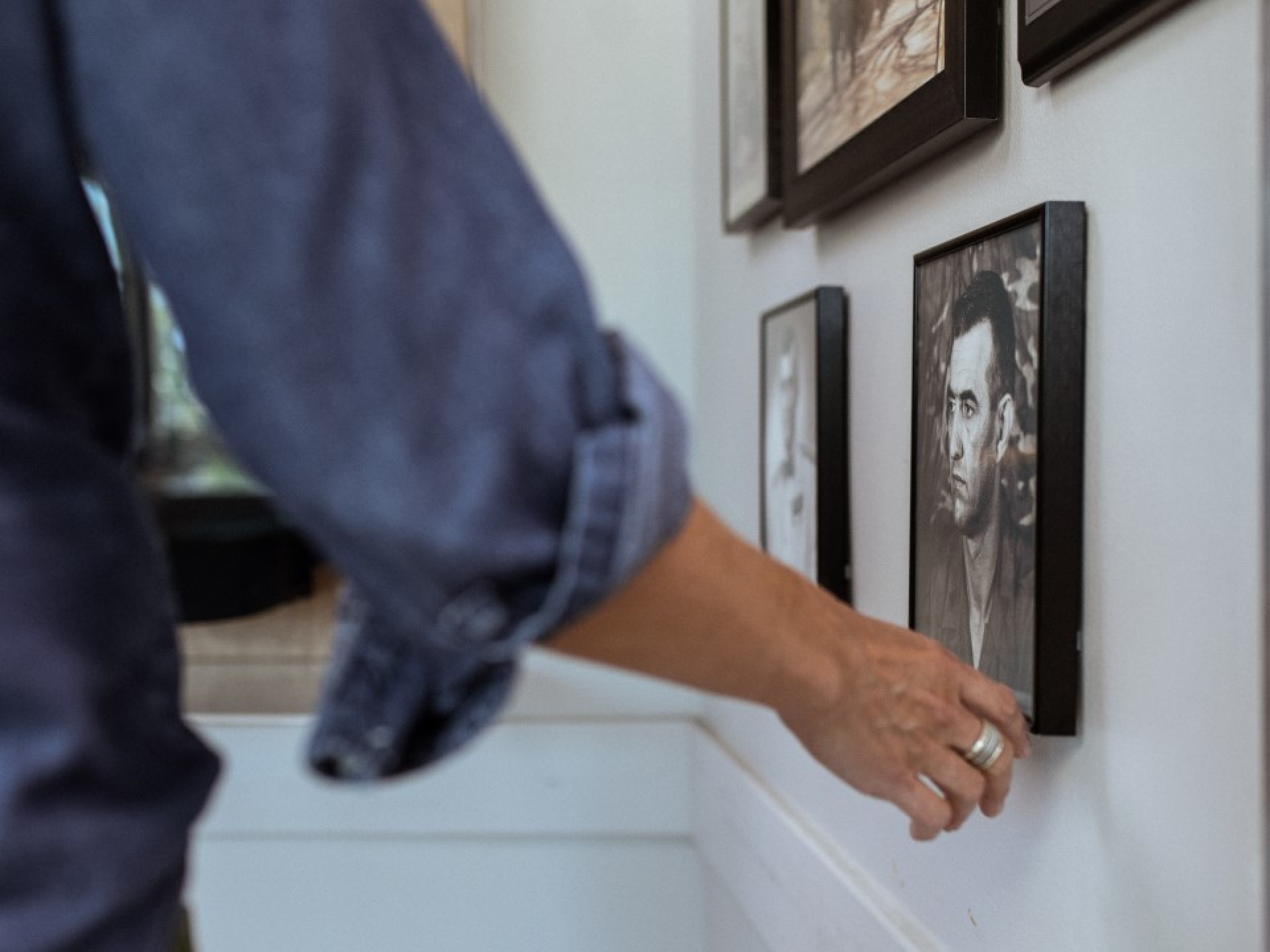 Adjusting photo on a wall