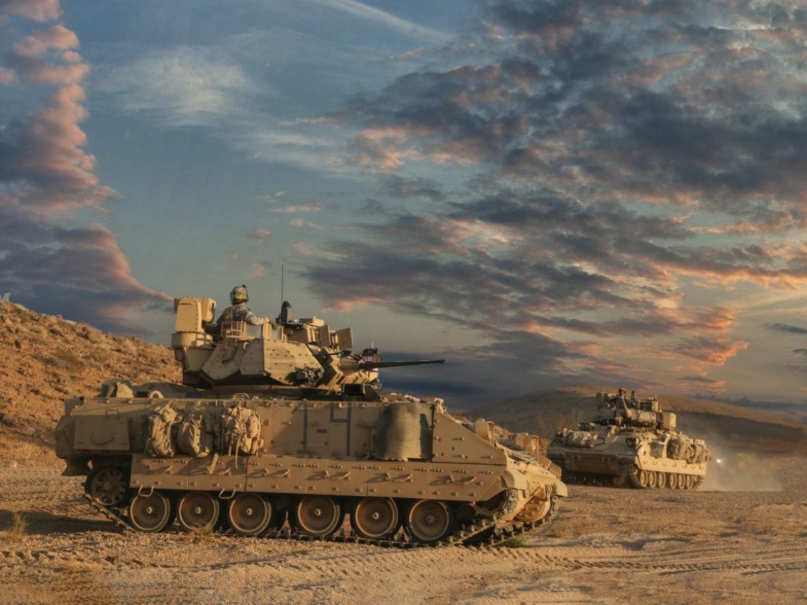 Land defense vehicles in the middle of a desert