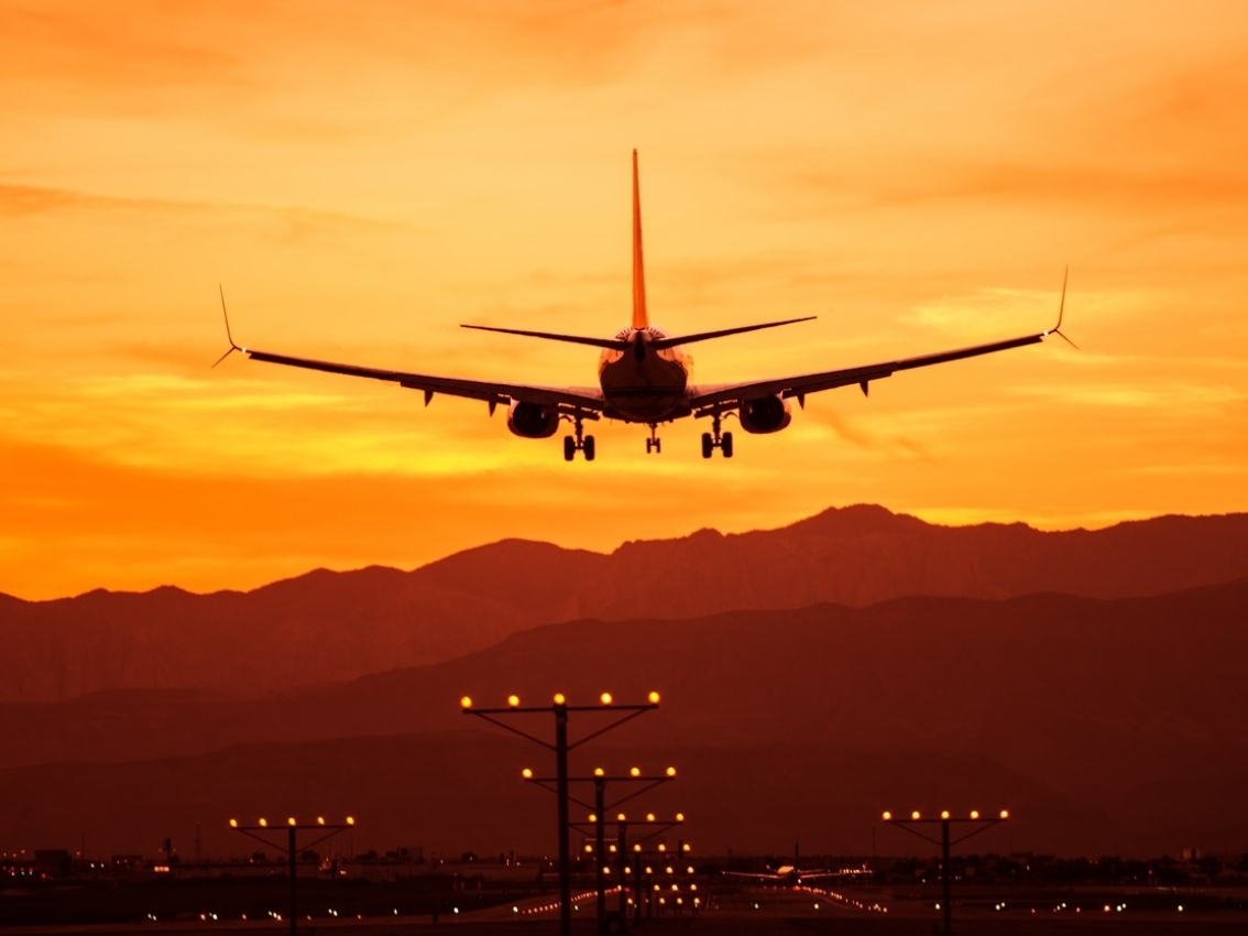 Airplane landing on landing strip