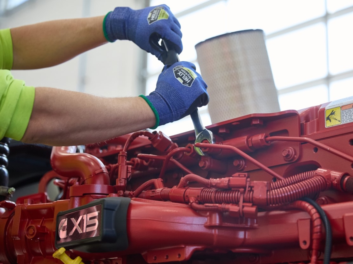 Mechanic performing maintenance on the Cummins X15