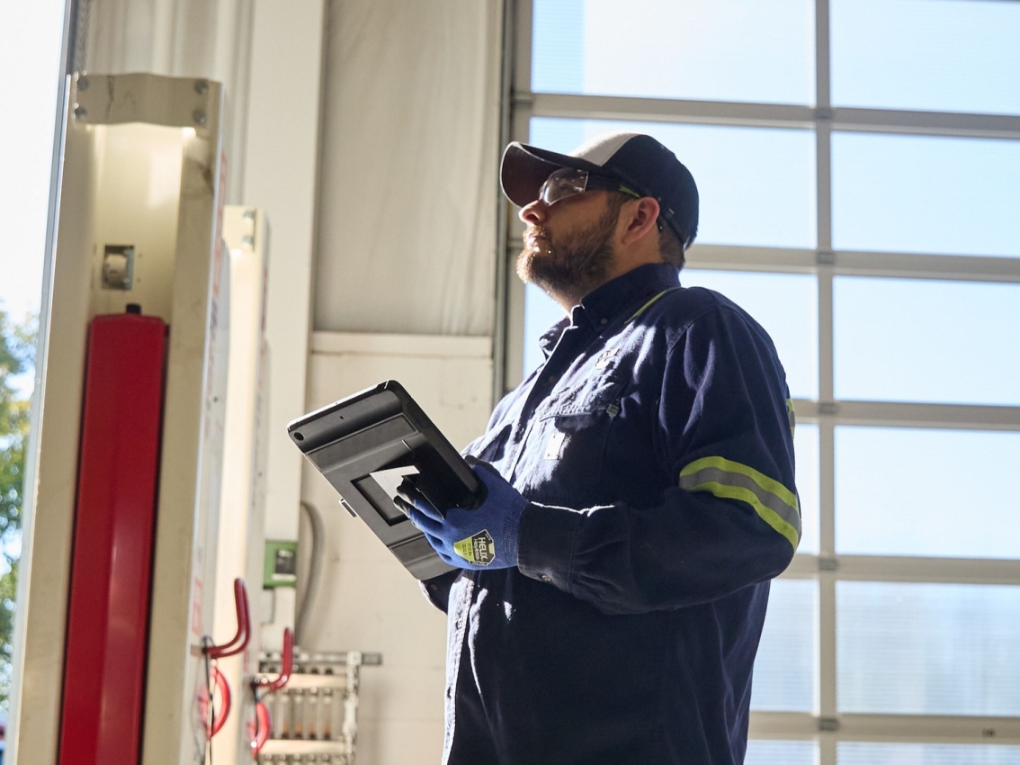 service technician checking engine