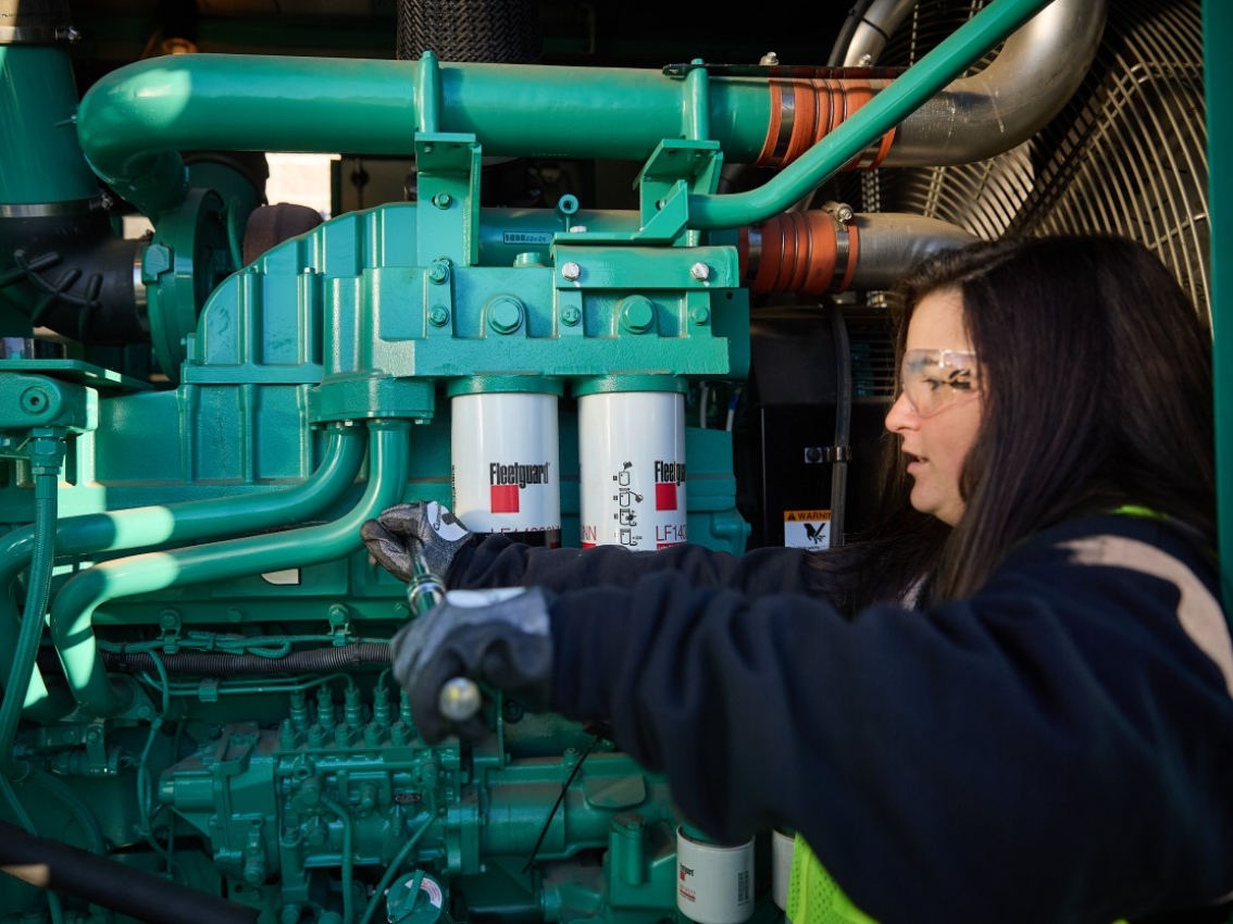 Cummins mechanic providing support on generator