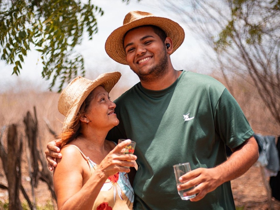 Two people on a ranch drinking water