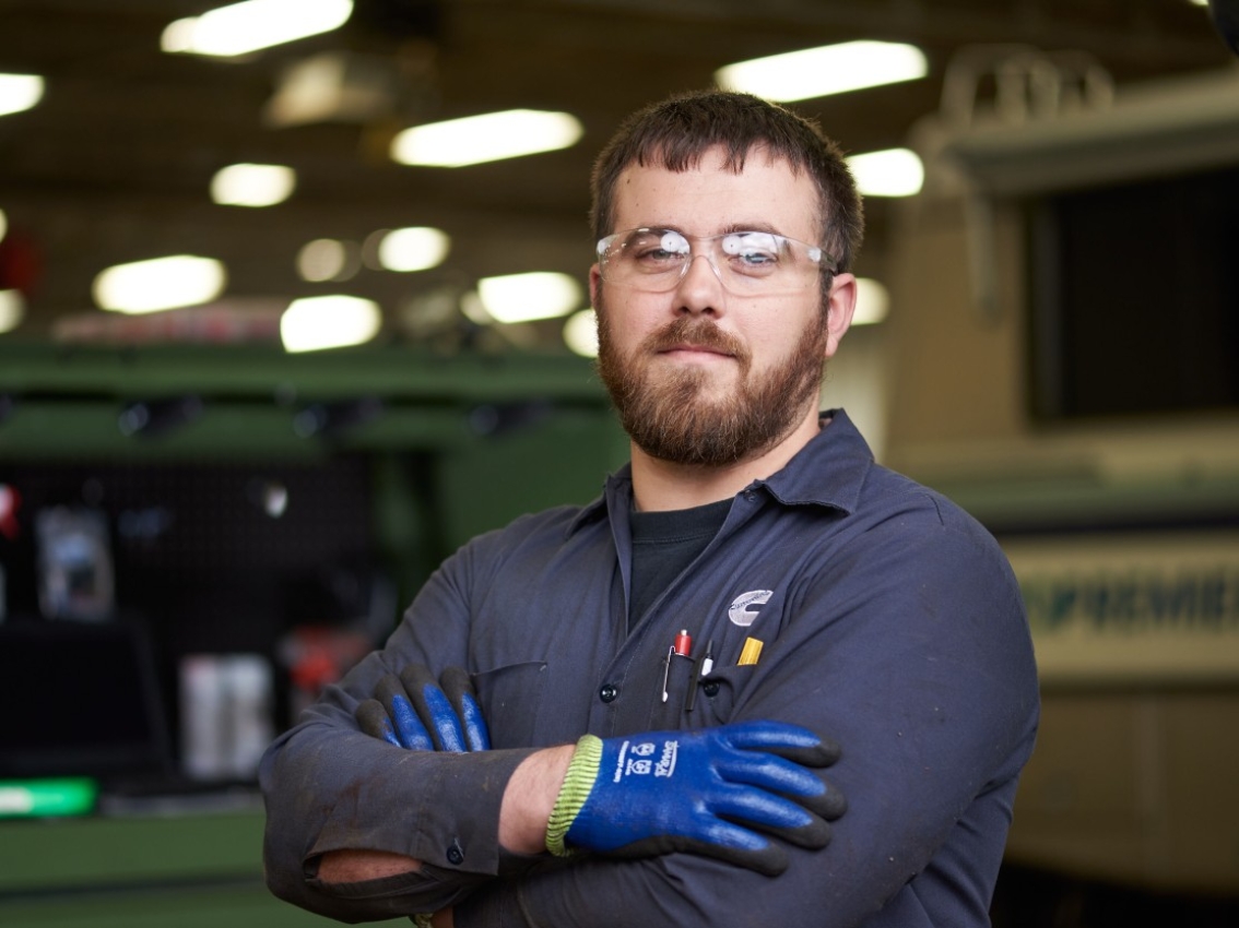 Cummins service technician crossing his arms