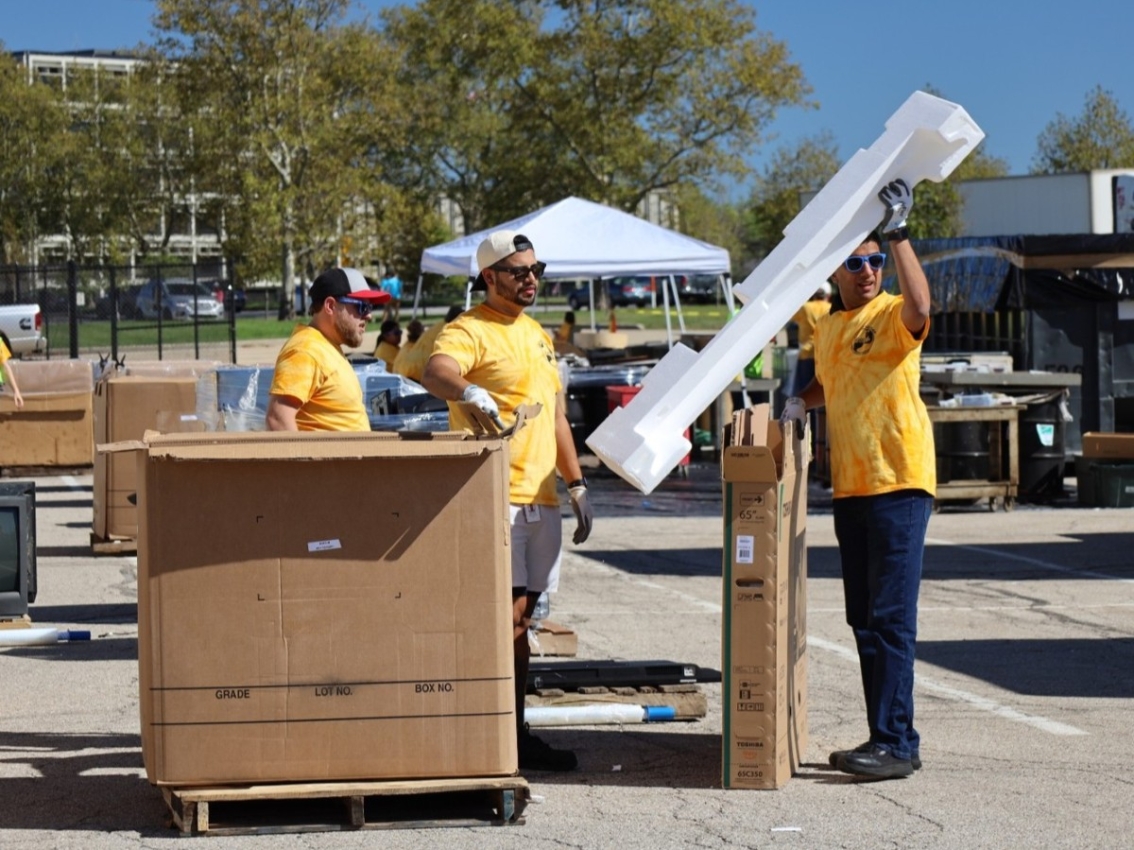 employees unpacking freight box